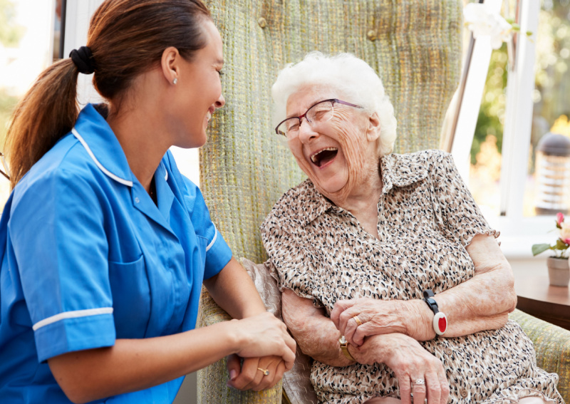 Nurse giving elderly patient care