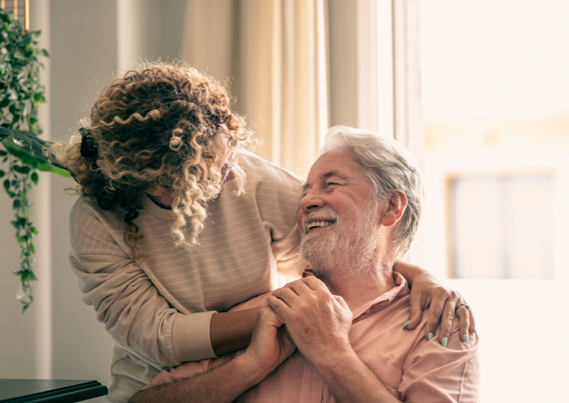 A man and woman at an assisted living home.