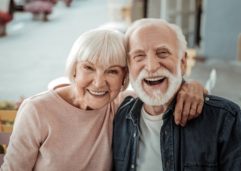 Two happy seniors in an assisted living home.