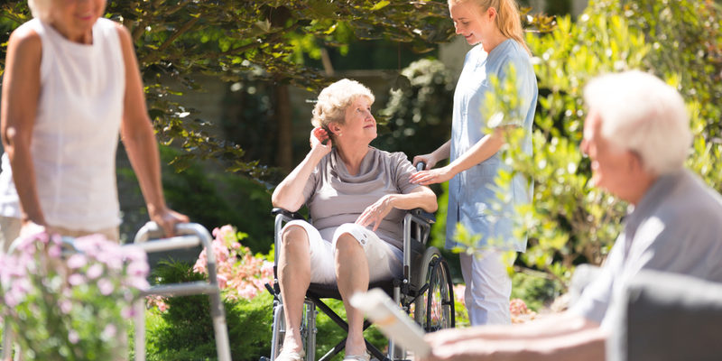 LTC-insurance-policy-coverage Seniors enjoying the benefits of LTC insurance at an assisted living home.