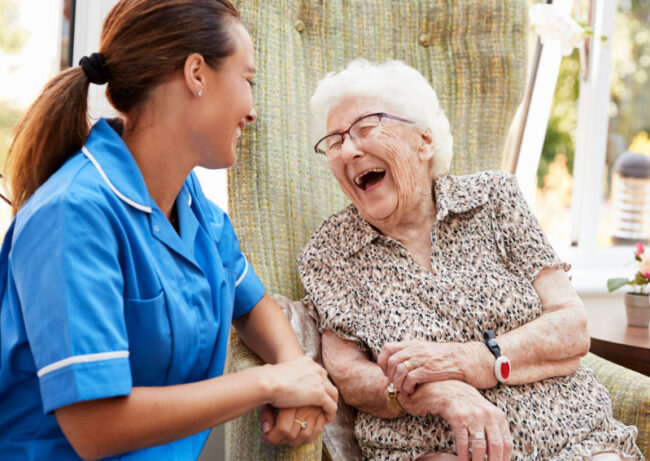 Nurse giving elderly patient care