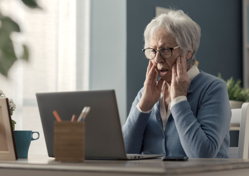 senior looking at her laptop