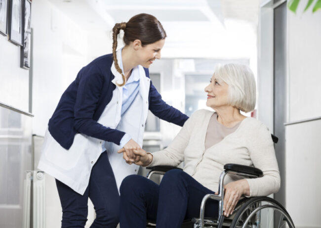 image shows senior being cared for at an assisted living facility