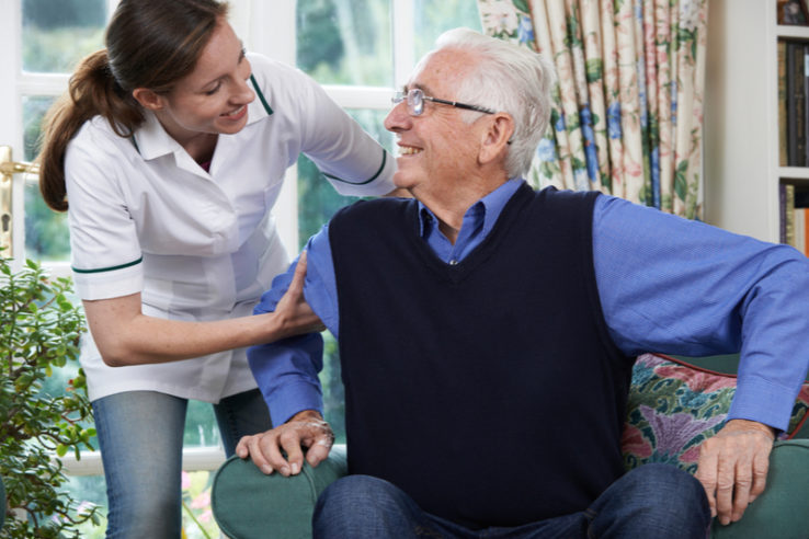 The-Relation-Between-Aging-And-Vision A female nurse assisting patient at an assisted living facility