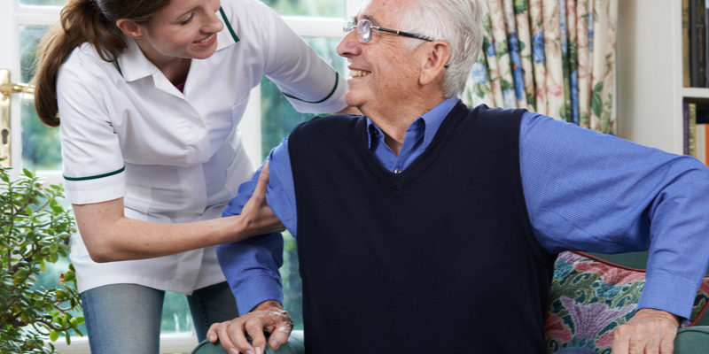 The-Relation-Between-Aging-And-Vision A female nurse assisting patient at an assisted living facility