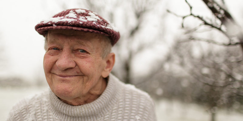 A senior enjoying life at an assisted living home during winter.