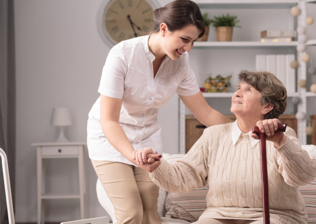 understanding-medicare-medicaid A medical professional helps a senior understand medicare.