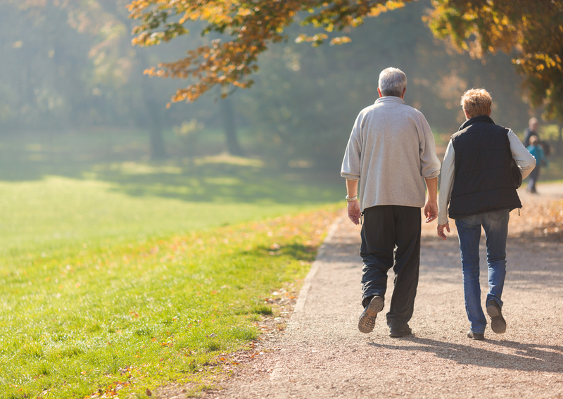 A senior walking in assisted living.